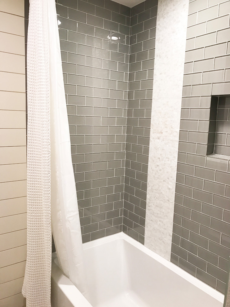 Example of a small country kids' gray tile and glass tile porcelain tile and gray floor bathroom design with raised-panel cabinets, white cabinets, a two-piece toilet, gray walls, an undermount sink, quartzite countertops and gray countertops
