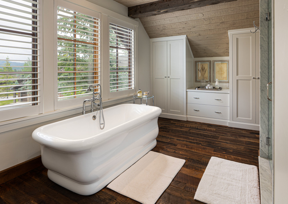 Photo of a medium sized rustic ensuite bathroom in Other with shaker cabinets, white cabinets, a freestanding bath, white walls, white worktops, a single sink, a built in vanity unit and a wood ceiling.