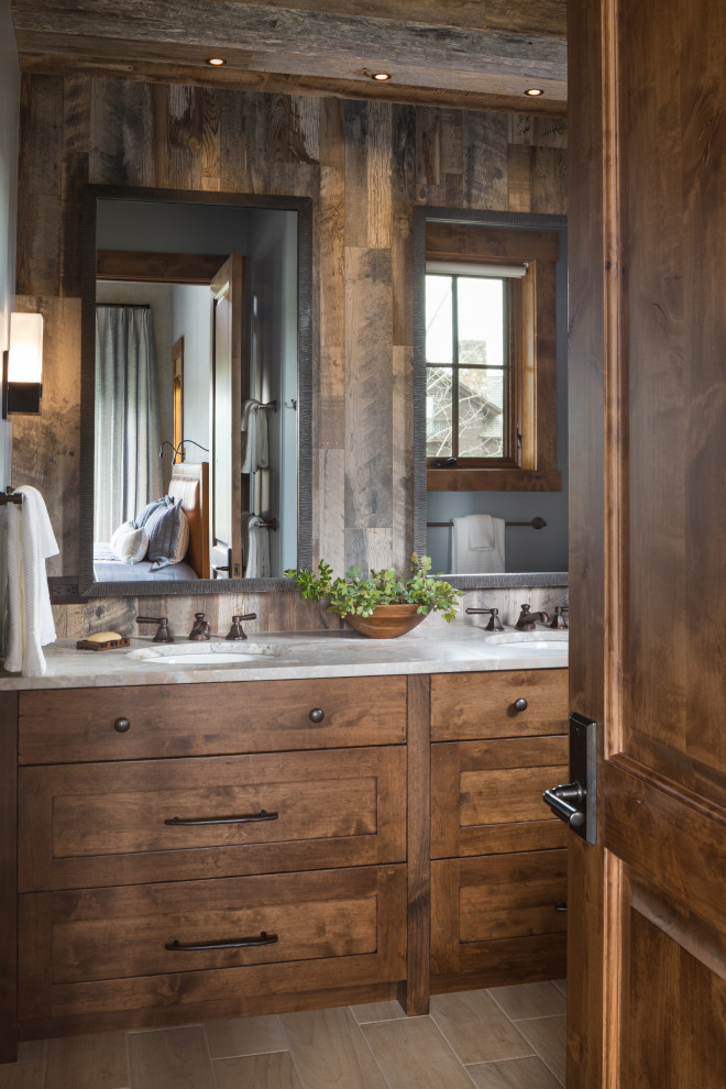 Inspiration for a rustic bathroom in Jackson with brown cabinets, marble worktops, double sinks and a built in vanity unit.