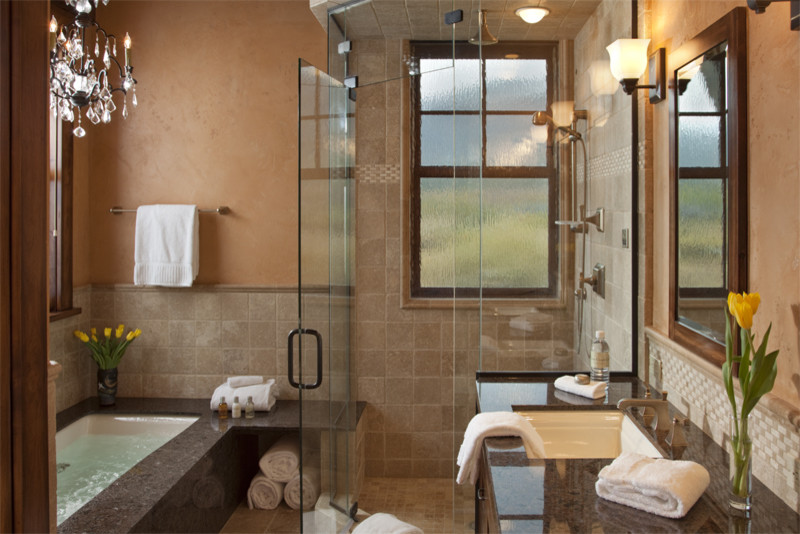 Example of a mid-sized mountain style master beige tile travertine floor corner shower design in Other with an undermount sink, an undermount tub, flat-panel cabinets, dark wood cabinets, granite countertops, a one-piece toilet and beige walls