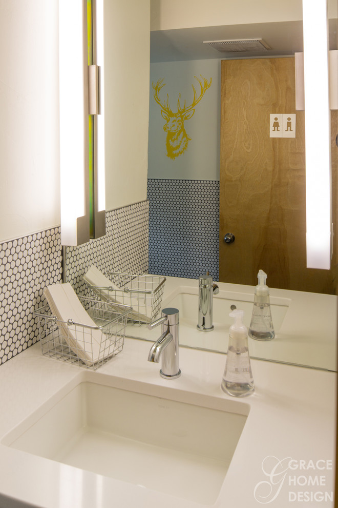 Example of a trendy white tile bathroom design in Other with an undermount sink and a two-piece toilet