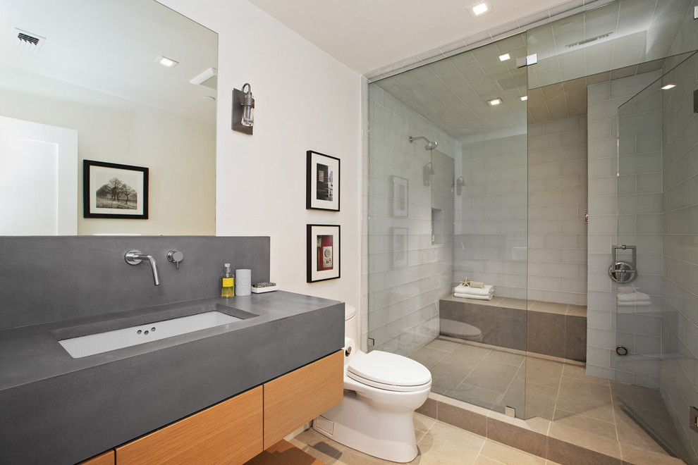 Doorless shower - mid-sized contemporary 3/4 white tile and subway tile porcelain tile doorless shower idea in San Francisco with furniture-like cabinets, medium tone wood cabinets, a one-piece toilet, white walls, an undermount sink and quartzite countertops