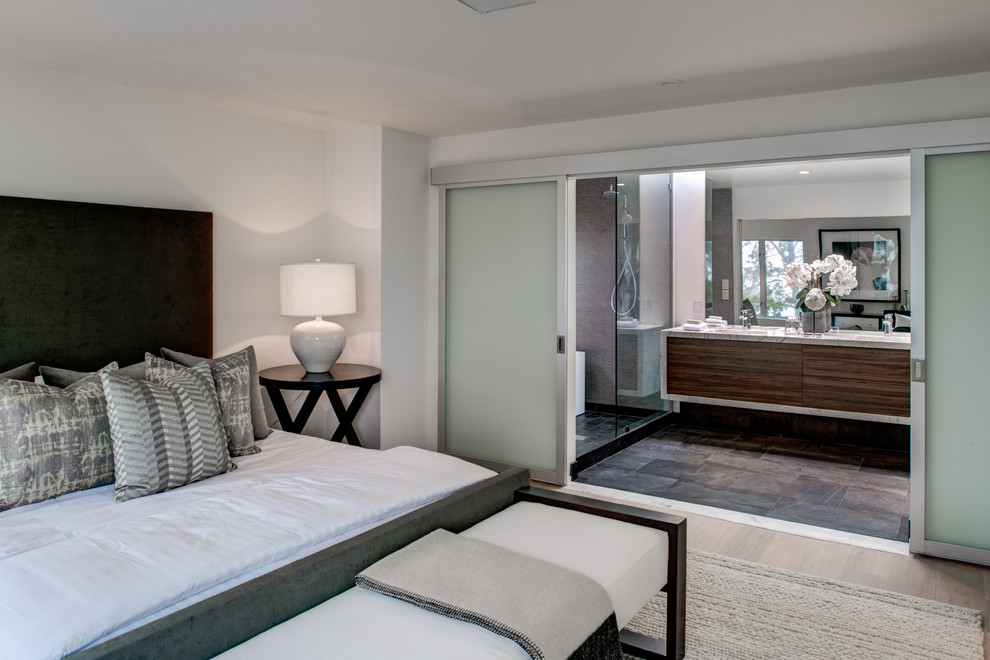 Photo of a medium sized contemporary bedroom in San Francisco with white walls and porcelain flooring.