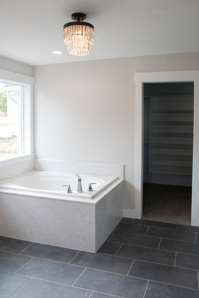 Inspiration for a mid-sized craftsman master ceramic tile and gray floor bathroom remodel in Salt Lake City with shaker cabinets, white cabinets, gray walls, an undermount sink, quartz countertops and a hinged shower door