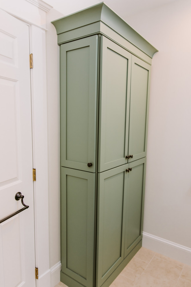 This is an example of a small traditional ensuite bathroom in Baltimore with shaker cabinets, green cabinets, a corner shower, a two-piece toilet, white tiles, metro tiles, white walls, travertine flooring, a built-in sink, soapstone worktops, beige floors, a hinged door, white worktops, a wall niche, a single sink and a built in vanity unit.