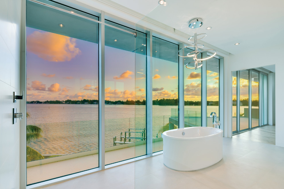 Inspiration for a large ensuite bathroom in Miami with a freestanding bath.
