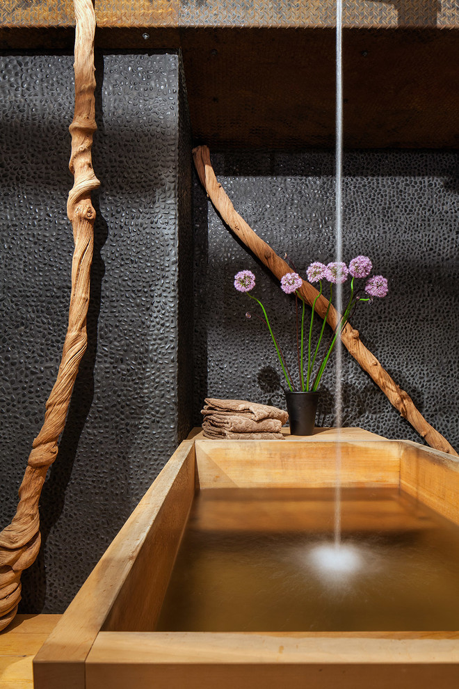 World-inspired ensuite bathroom in Portland with a japanese bath and a shower/bath combination.