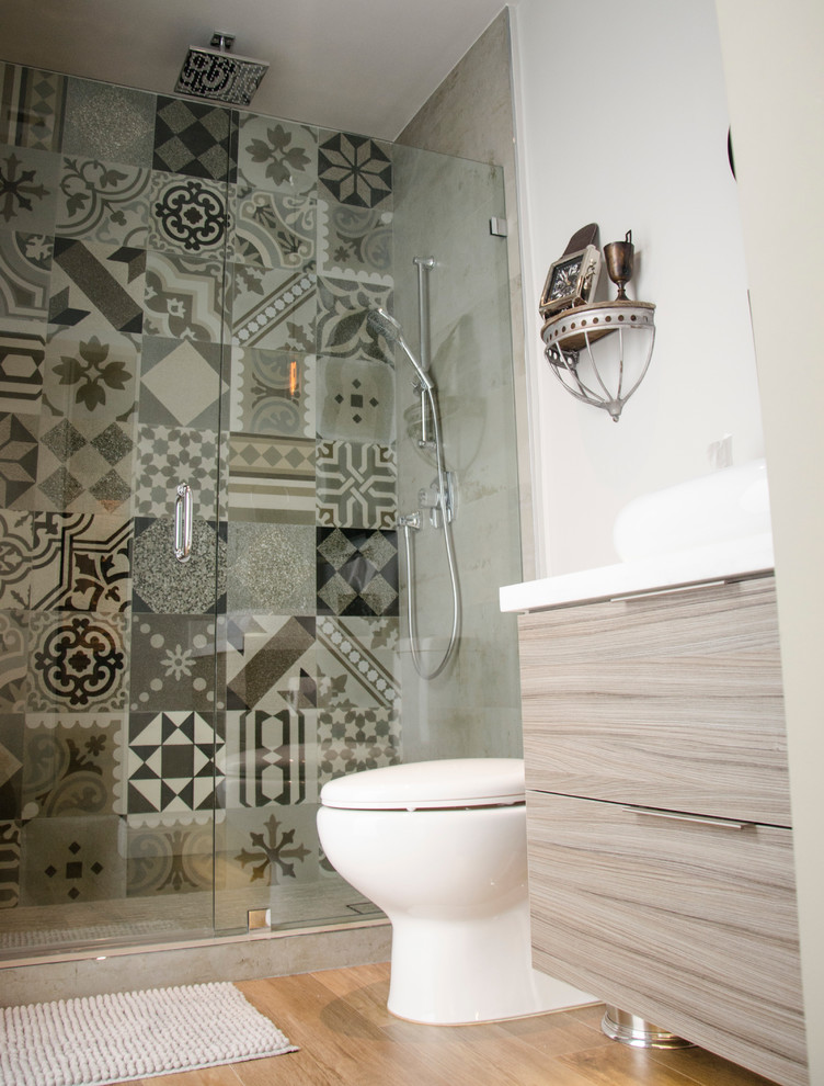 Inspiration for a small modern 3/4 multicolored tile alcove shower remodel in Miami with a vessel sink, flat-panel cabinets, gray cabinets, quartz countertops and a one-piece toilet
