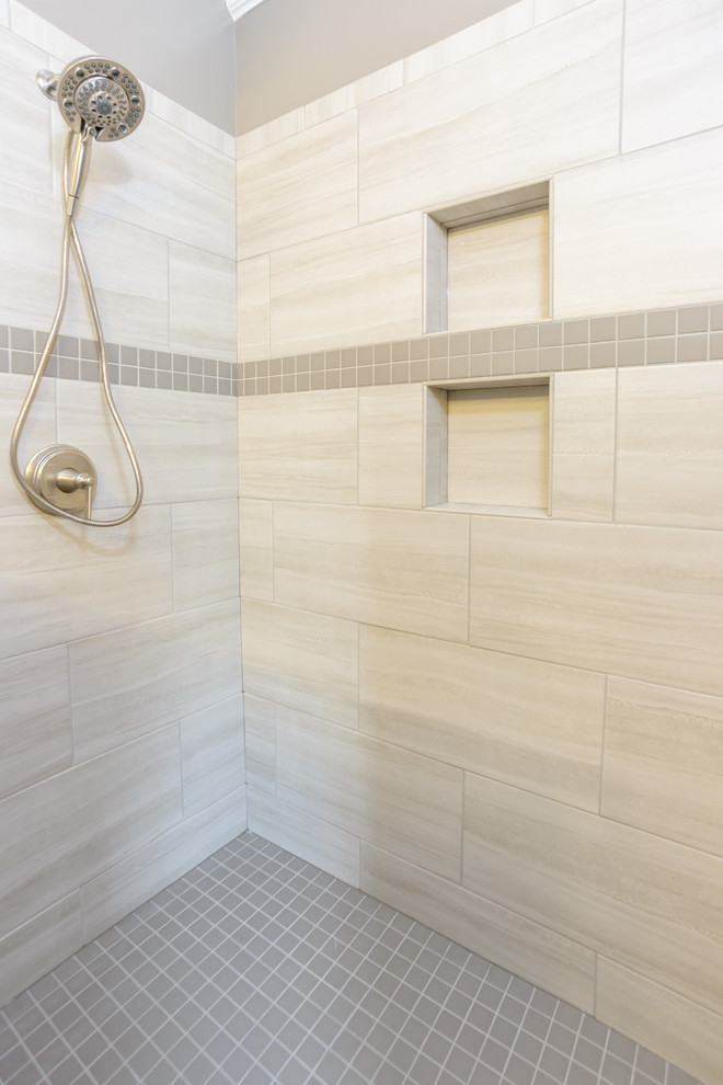 Inspiration for a medium sized traditional ensuite bathroom in Kansas City with raised-panel cabinets, white cabinets, a freestanding bath, an alcove shower, grey tiles, porcelain tiles, grey walls, porcelain flooring, a submerged sink, terrazzo worktops, brown floors and an open shower.