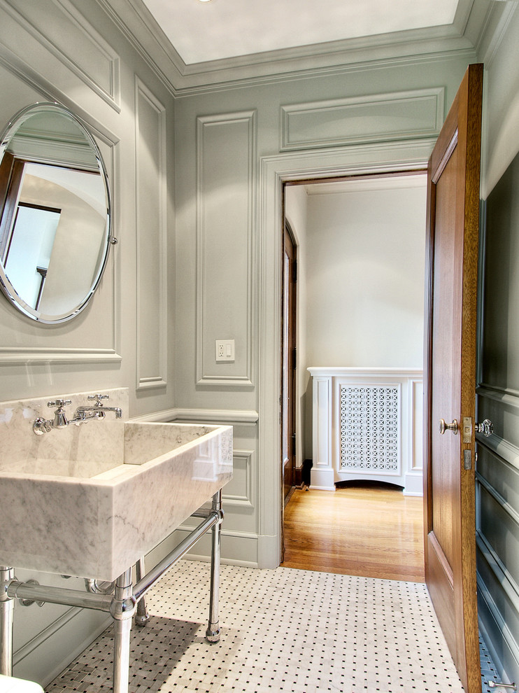Foto di una stanza da bagno minimal con lavabo a consolle e pareti grigie