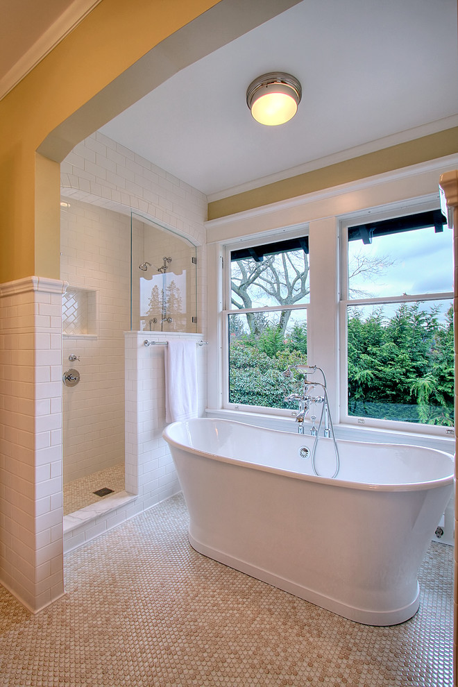 Trendy beige floor freestanding bathtub photo in Seattle