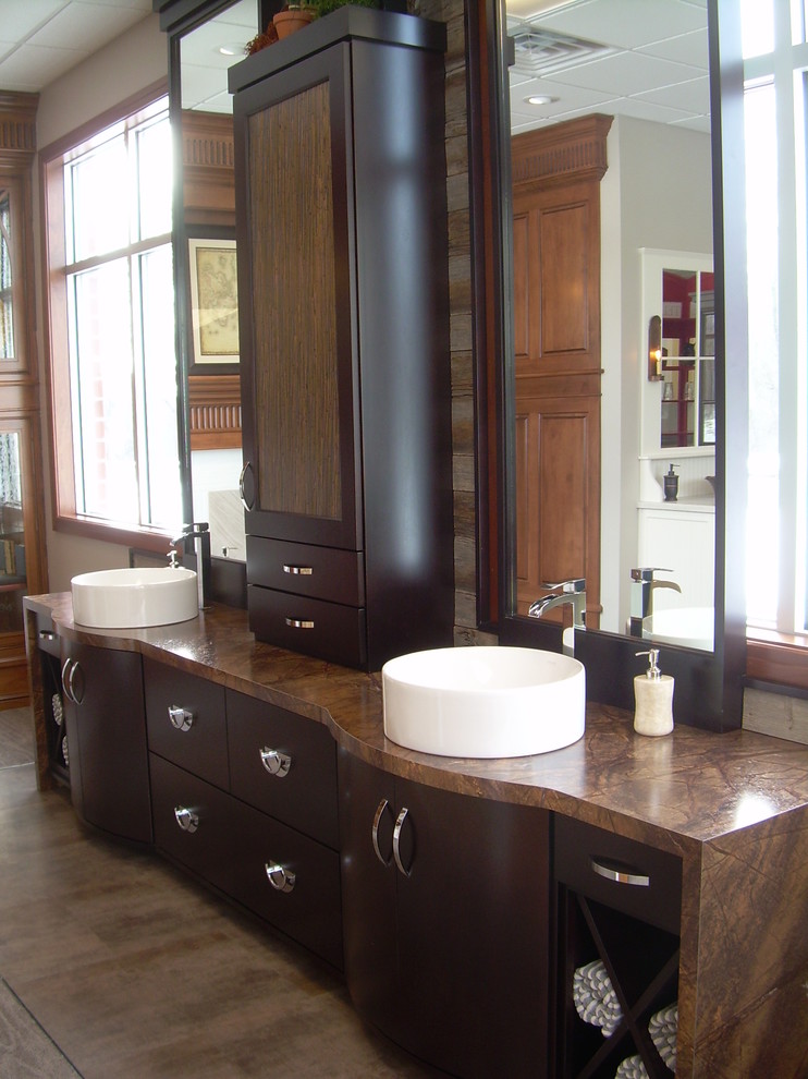 Mid-sized trendy master bathroom photo in Other with a vessel sink, flat-panel cabinets, dark wood cabinets, laminate countertops and brown walls