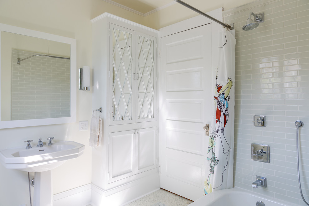 Example of a small arts and crafts kids' gray tile and subway tile ceramic tile bathroom design in New Orleans with glass-front cabinets, white cabinets, a pedestal sink, a two-piece toilet and beige walls