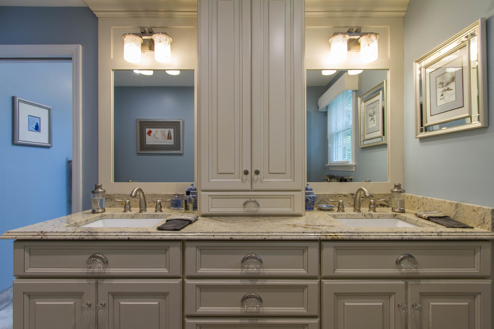 Example of a mid-sized classic master multicolored tile porcelain tile bathroom design in Other with a drop-in sink, furniture-like cabinets, white cabinets, granite countertops, a two-piece toilet and blue walls