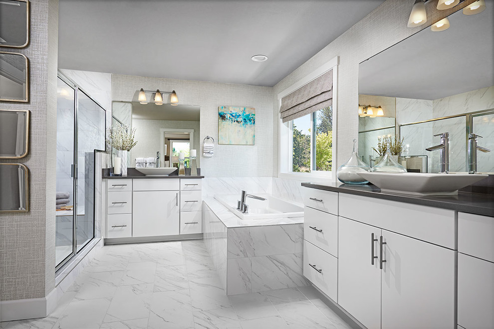 Inspiration for a contemporary bathroom in Denver with raised-panel cabinets, white cabinets, white tiles, grey walls, a vessel sink and white floors.