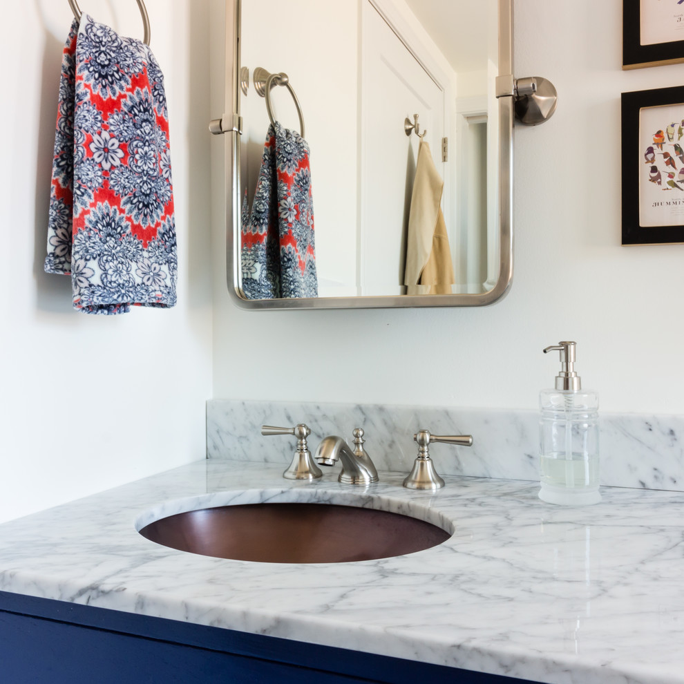 Transitional master porcelain tile and gray floor bathroom photo in Boston with white walls, an undermount sink, blue cabinets and marble countertops