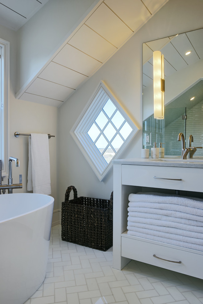 This is an example of a nautical bathroom in Other with flat-panel cabinets, white cabinets, a freestanding bath and white walls.