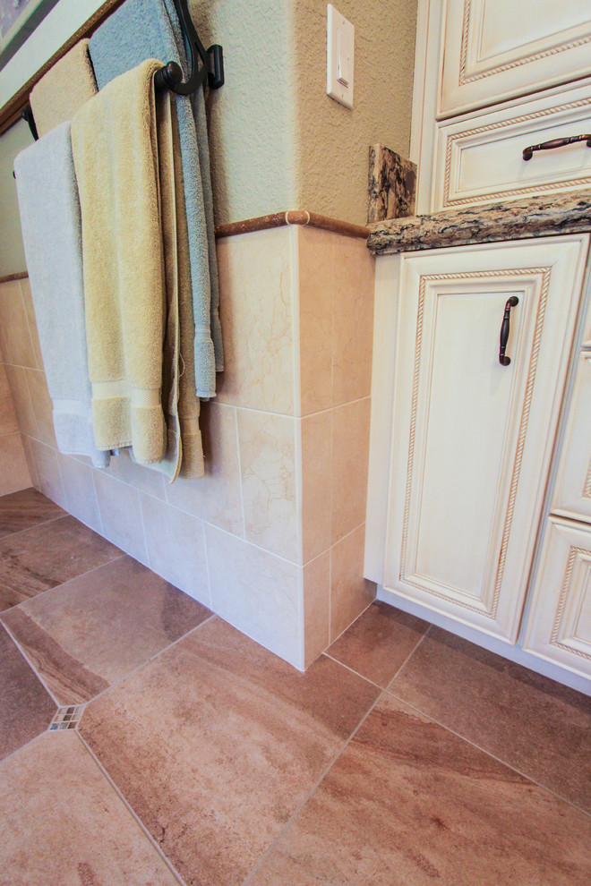 Example of a large classic master beige tile and porcelain tile porcelain tile bathroom design in San Francisco with an undermount sink, recessed-panel cabinets, white cabinets, quartzite countertops, a two-piece toilet and green walls