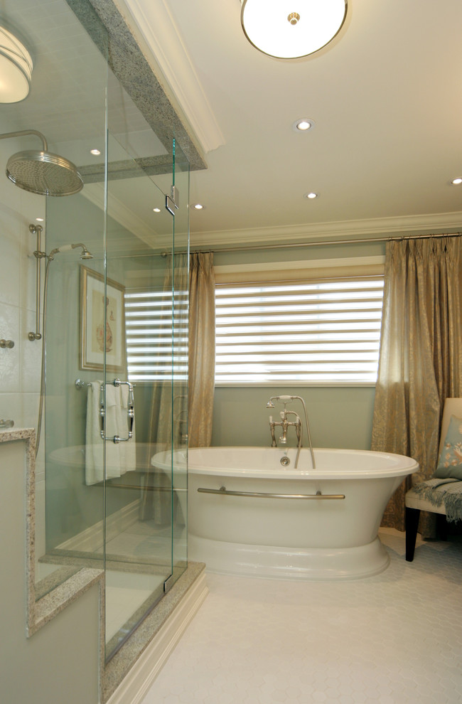 На фото: главная ванная комната среднего размера в современном стиле с отдельно стоящей ванной, душем в нише, синими стенами, белой плиткой, керамической плиткой, полом из мозаичной плитки и столешницей из известняка