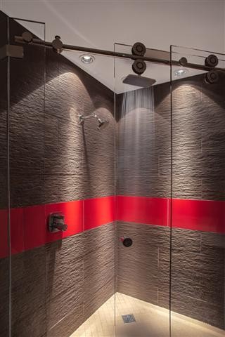 Example of a mid-sized trendy master brown tile and porcelain tile porcelain tile corner shower design in San Francisco with a vessel sink, flat-panel cabinets, dark wood cabinets, quartz countertops, a two-piece toilet and white walls