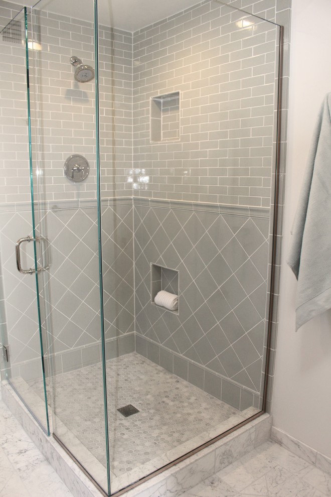 This is an example of a medium sized traditional ensuite bathroom in San Francisco with shaker cabinets, dark wood cabinets, a corner shower, a two-piece toilet, green tiles, porcelain tiles, white walls, marble flooring, a submerged sink and marble worktops.