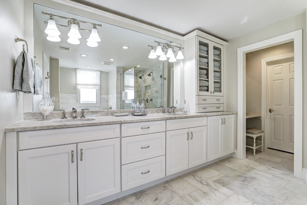Mid-sized transitional master white tile and ceramic tile marble floor and white floor bathroom photo in New York with shaker cabinets, white cabinets, a two-piece toilet, gray walls, an undermount sink, marble countertops and white countertops