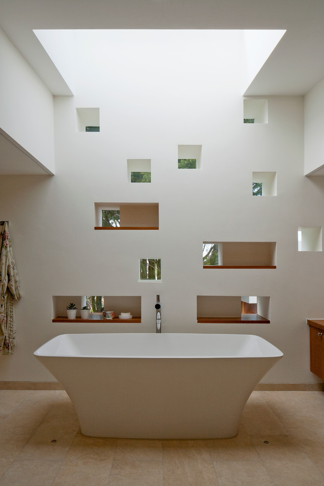 Photo of a contemporary bathroom in Channel Islands with a freestanding bath.