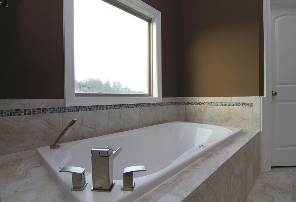This is an example of a large traditional ensuite bathroom in Raleigh with an integrated sink, recessed-panel cabinets, white cabinets, an alcove bath, a corner shower, a one-piece toilet, beige tiles, ceramic tiles, brown walls and ceramic flooring.