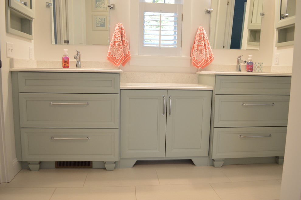 Inspiration for a mid-sized transitional kids' blue tile and glass tile porcelain tile and white floor bathroom remodel in Boston with recessed-panel cabinets, blue cabinets, a two-piece toilet, white walls, an undermount sink and quartz countertops