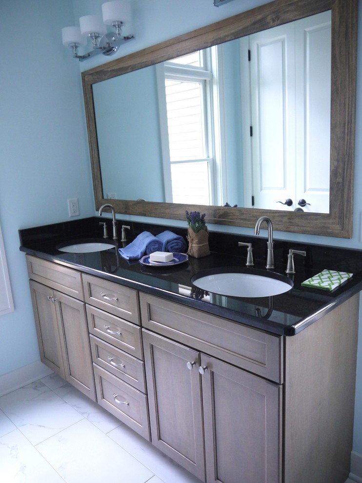 Inspiration for a small transitional bathroom remodel in Grand Rapids with a vessel sink, recessed-panel cabinets, white cabinets and green walls