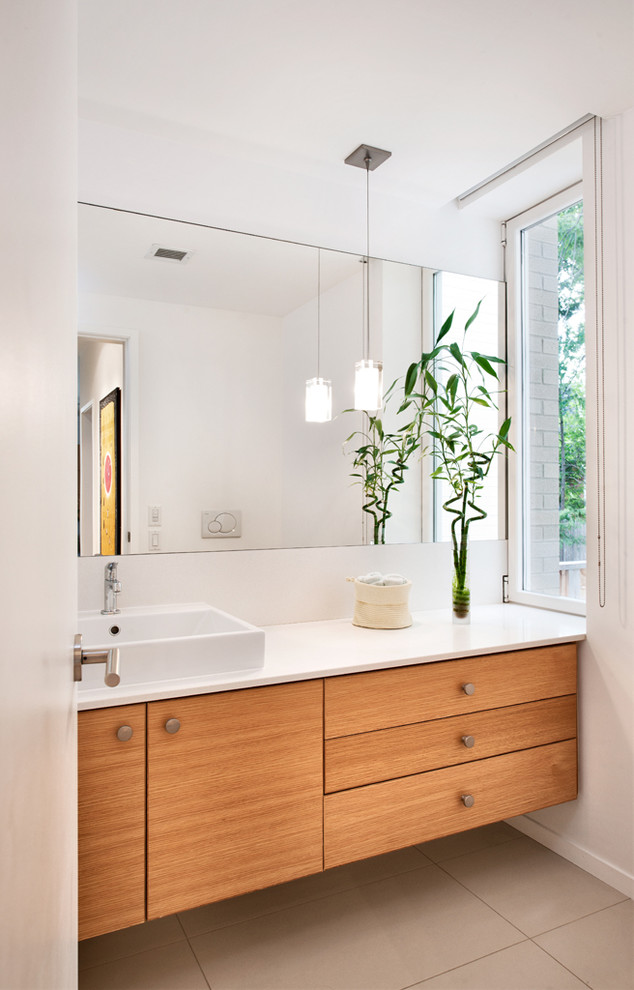 Bathroom - contemporary bathroom idea in Toronto with flat-panel cabinets, medium tone wood cabinets, white walls and a vessel sink