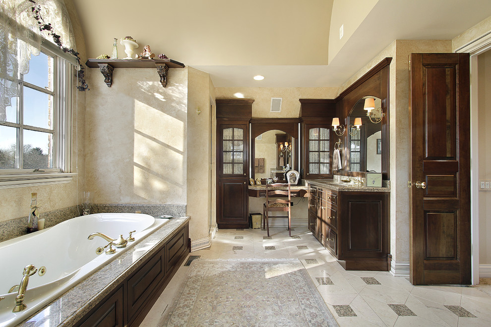 Design ideas for a large traditional ensuite bathroom in Atlanta with a submerged sink, beaded cabinets, medium wood cabinets, granite worktops, a built-in bath, a corner shower, a one-piece toilet, beige tiles, stone tiles, beige walls and marble flooring.