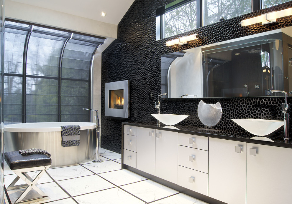 Minimalist bathroom photo in New York with a vessel sink and black walls