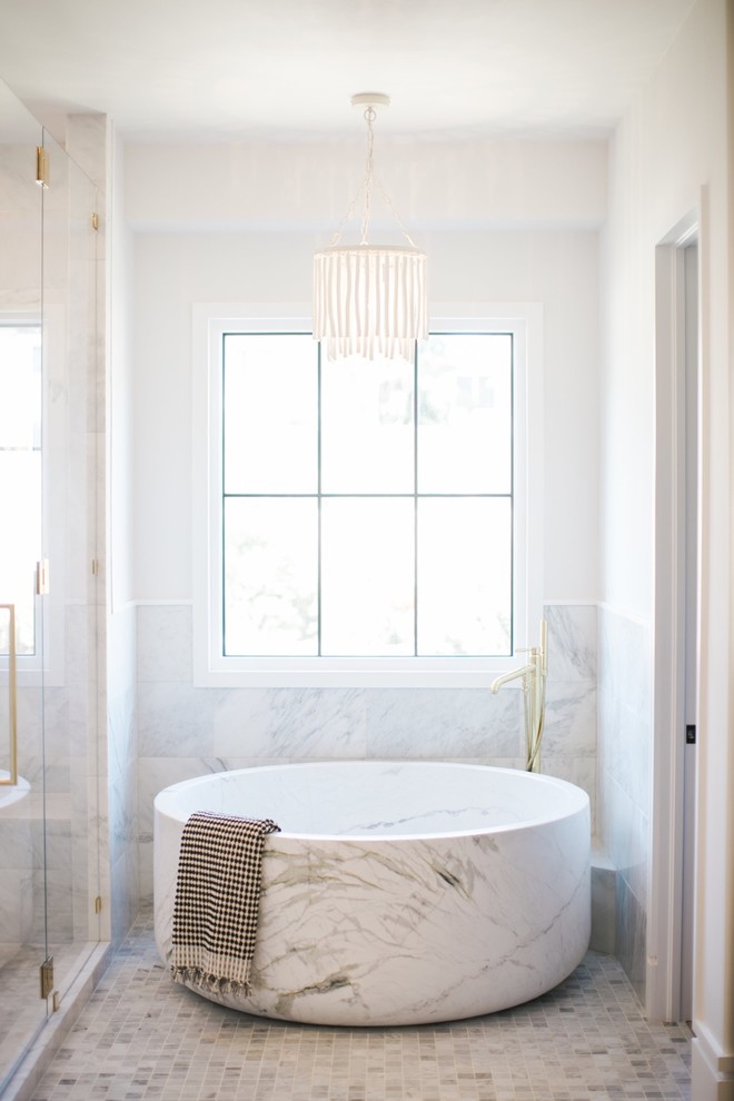 Mid-sized minimalist master white tile and marble tile marble floor and multicolored floor bathroom photo in Orange County with shaker cabinets, gray cabinets, a one-piece toilet, white walls, an undermount sink, marble countertops, a hinged shower door and white countertops