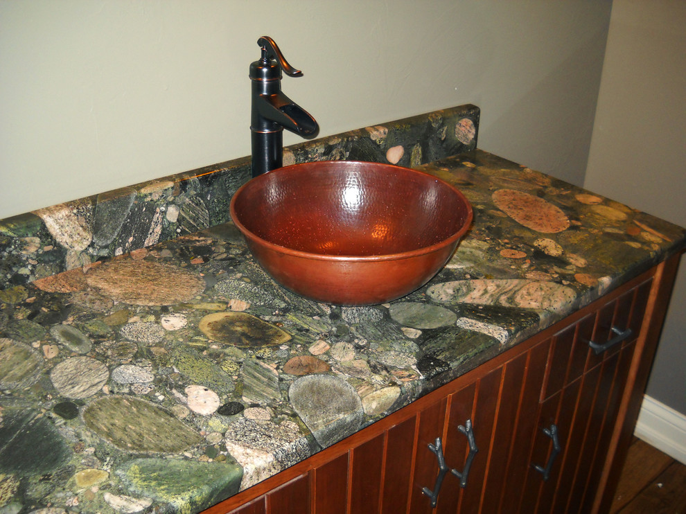 This is an example of a bathroom in Other with granite worktops and green worktops.