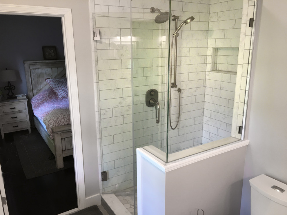 Inspiration for a small classic ensuite bathroom in Atlanta with recessed-panel cabinets, white cabinets, a corner shower, a two-piece toilet, yellow tiles, ceramic tiles, grey walls, porcelain flooring, a submerged sink, marble worktops, grey floors, a hinged door and white worktops.