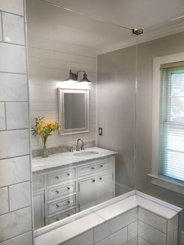 Example of a mid-sized farmhouse master black and white tile and ceramic tile porcelain tile, multicolored floor, double-sink and shiplap wall corner shower design in Atlanta with shaker cabinets, yellow cabinets, a two-piece toilet, gray walls, an undermount sink, marble countertops, a hinged shower door, multicolored countertops, a niche and a freestanding vanity