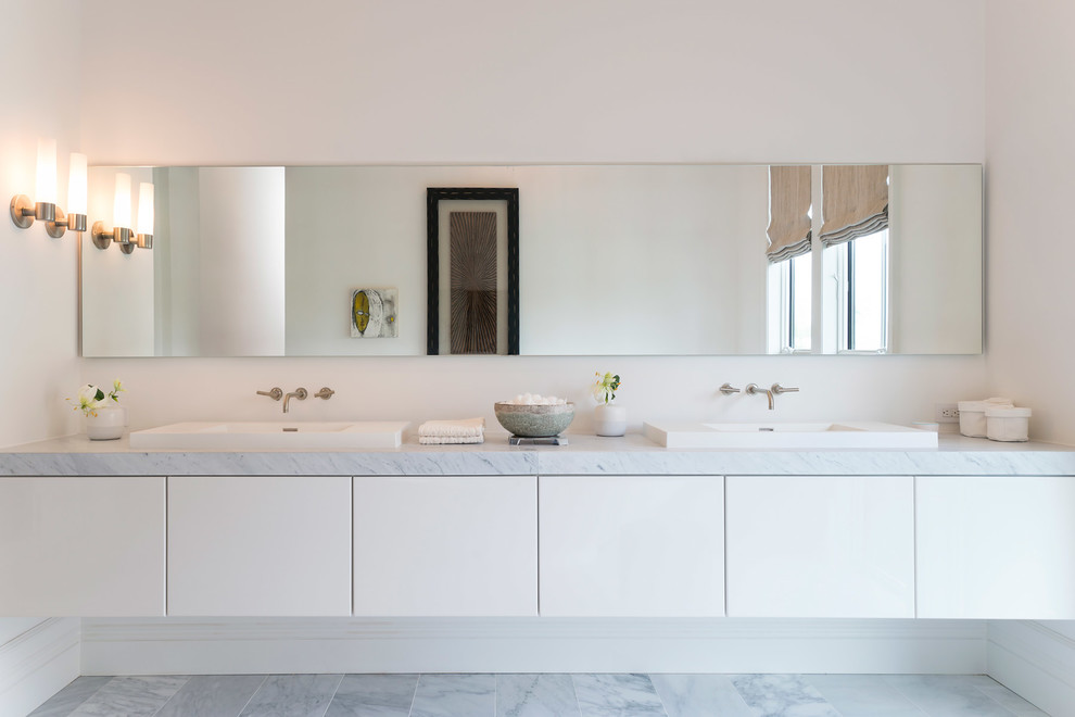 Medium sized contemporary bathroom in DC Metro with white walls and marble flooring.