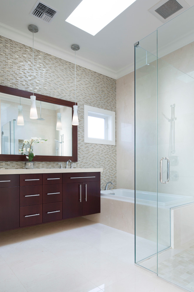 Mid-sized trendy master white tile and glass tile marble floor bathroom photo in Hawaii with flat-panel cabinets, dark wood cabinets, multicolored walls, an undermount sink and marble countertops