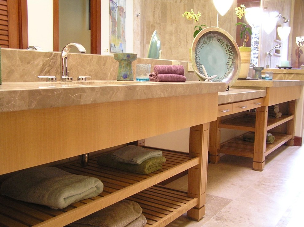 Example of a mid-sized island style master bathroom design in Hawaii with furniture-like cabinets, light wood cabinets and granite countertops