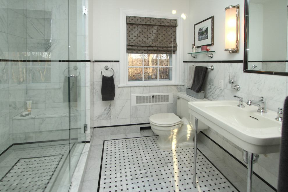 Photo of a medium sized traditional bathroom in Grand Rapids with an alcove shower, a one-piece toilet, black and white tiles, stone tiles, white walls, marble flooring and a pedestal sink.