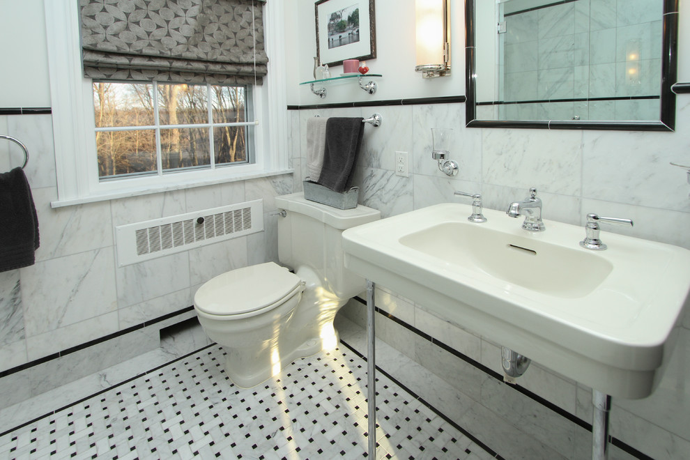 Medium sized classic shower room bathroom in Grand Rapids with an alcove shower, a one-piece toilet, black and white tiles, stone tiles, white walls, marble flooring and a pedestal sink.