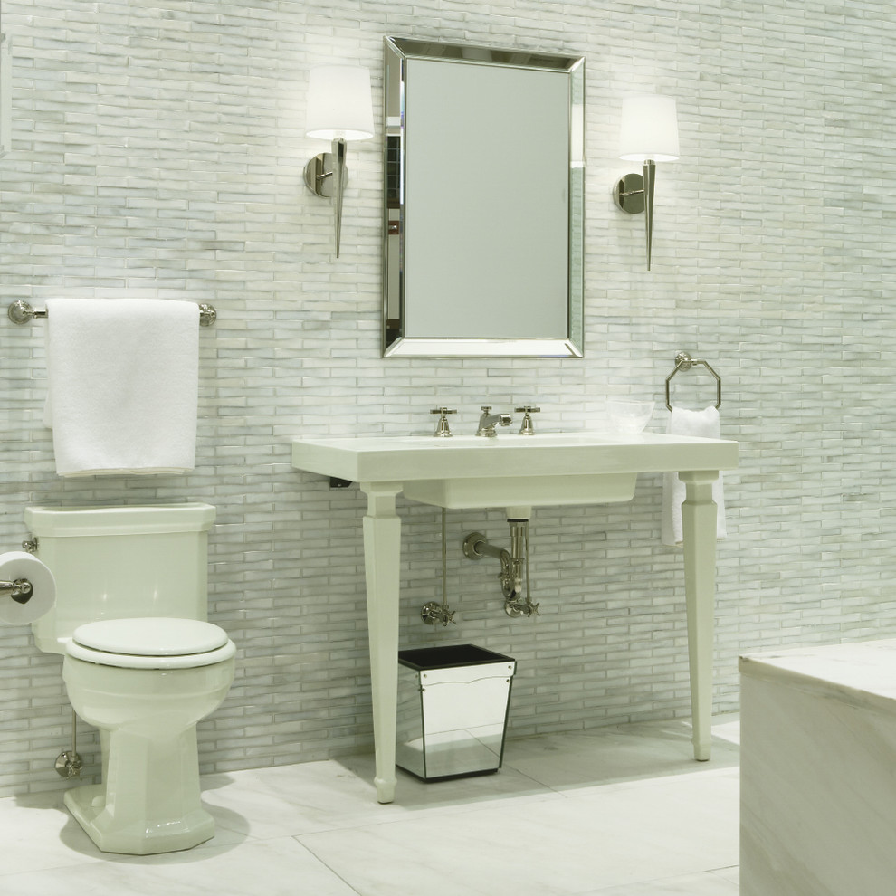 Mid-sized transitional 3/4 white tile and stone tile marble floor and white floor bathroom photo in Chicago with a one-piece toilet, white walls, a console sink and solid surface countertops
