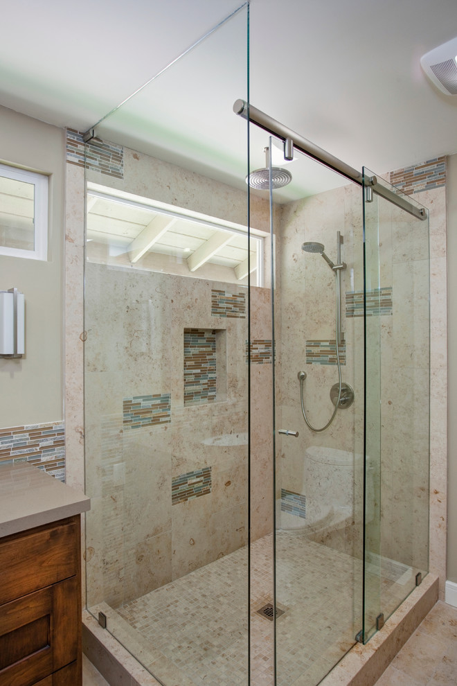 Corner shower - mid-sized contemporary master multicolored tile porcelain tile corner shower idea in San Diego with shaker cabinets, medium tone wood cabinets, a one-piece toilet, beige walls, an undermount sink and quartz countertops