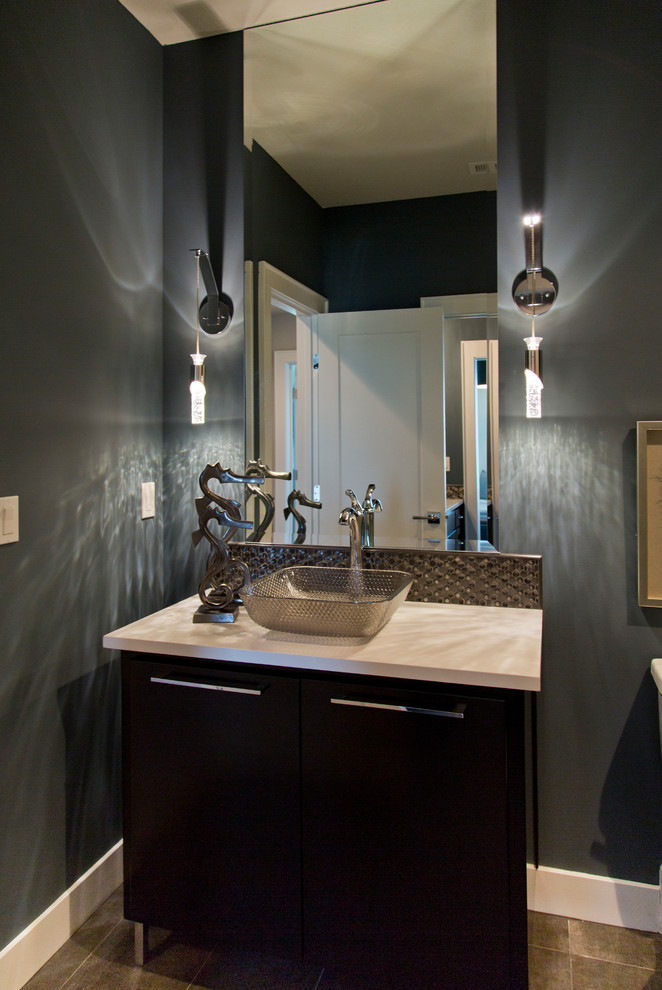Example of a mid-sized transitional 3/4 ceramic tile and beige floor bathroom design in Kansas City with furniture-like cabinets, black cabinets, gray walls, a vessel sink and white countertops