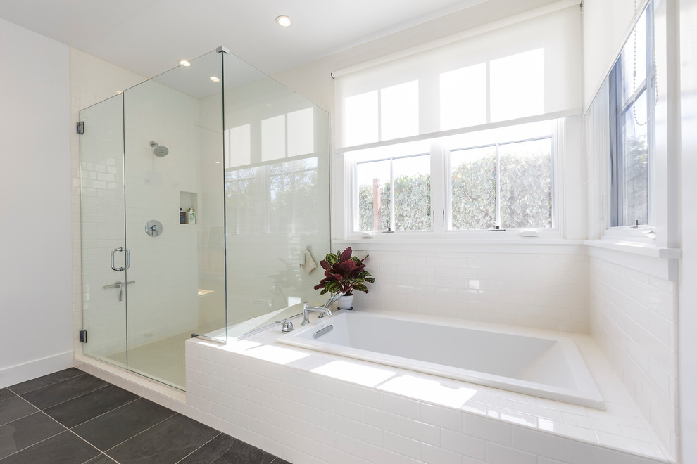 На фото: главная ванная комната среднего размера в стиле неоклассика (современная классика) с накладной ванной, угловым душем, белой плиткой, керамической плиткой, белыми стенами, полом из сланца, серым полом и душем с распашными дверями