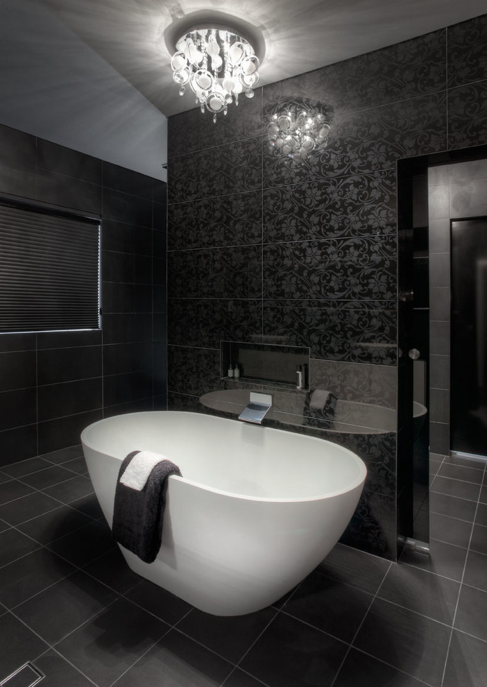 Example of a large minimalist master black tile and ceramic tile ceramic tile bathroom design in Perth with a wall-mount toilet and black walls