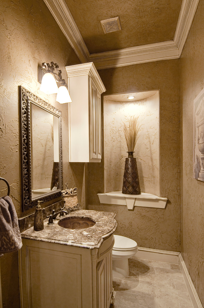 Example of a tuscan bathroom design in Dallas