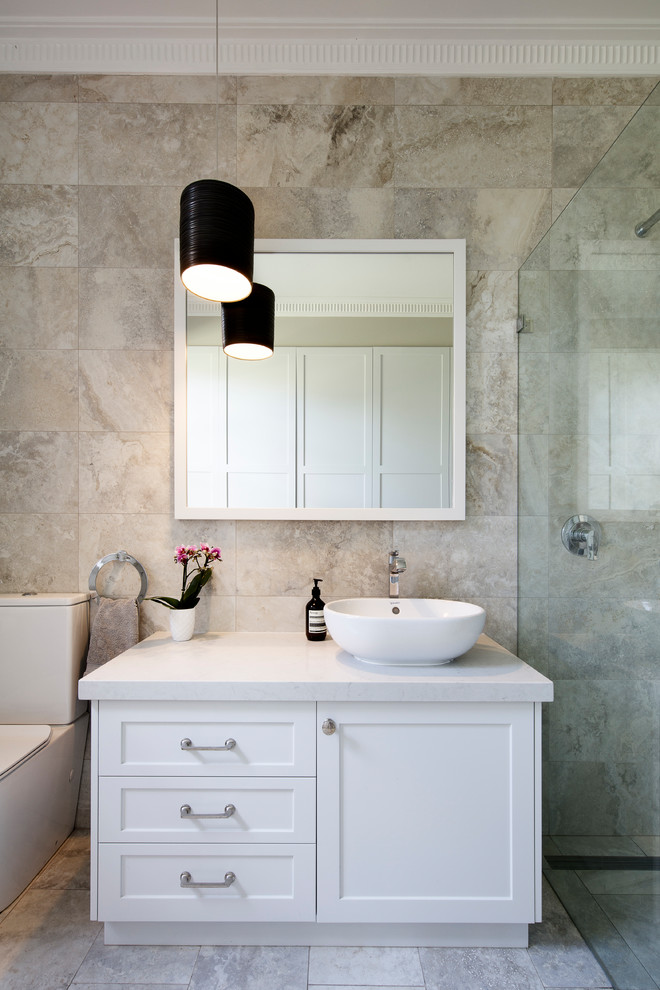 This is an example of a large classic family bathroom in Sydney with shaker cabinets, white cabinets, a built-in shower, a one-piece toilet, beige tiles, porcelain tiles, porcelain flooring, a vessel sink, engineered stone worktops, beige floors, a hinged door and beige worktops.