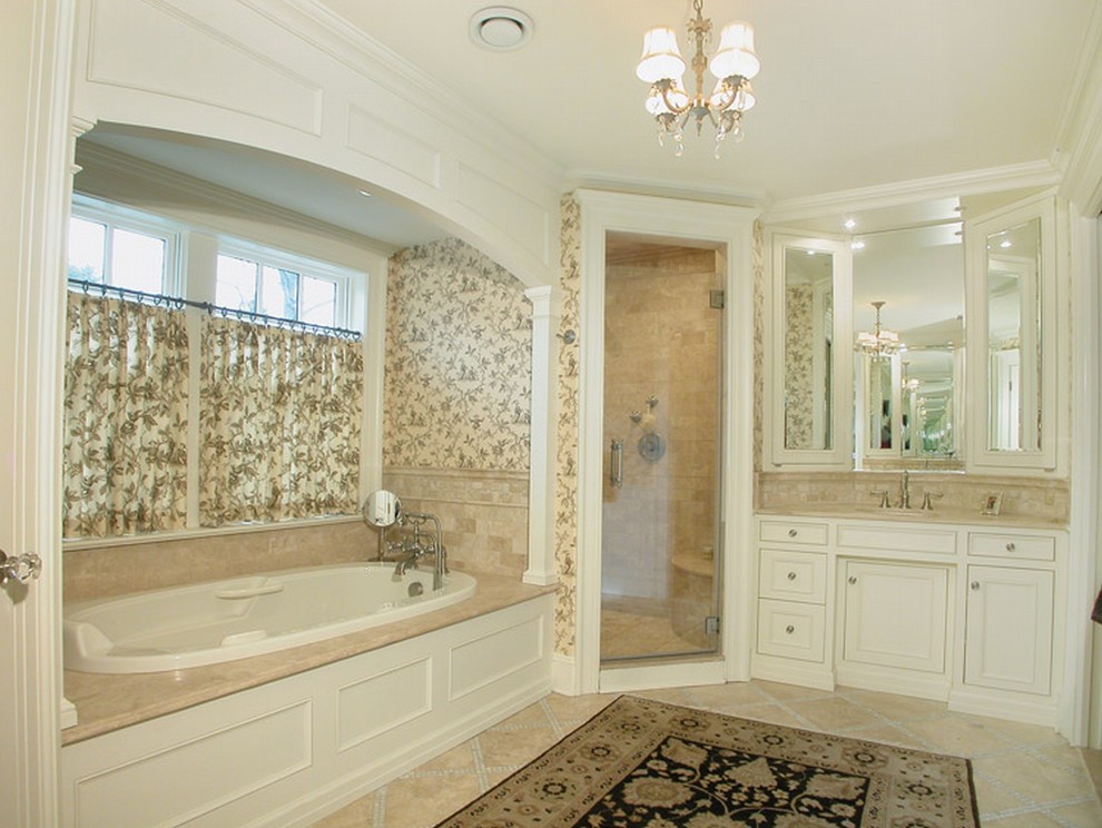 Classic bathroom in Newark with white cabinets, a built-in bath, an alcove shower and beige tiles.